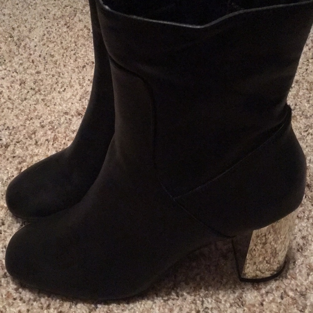 Black boots with gold heel